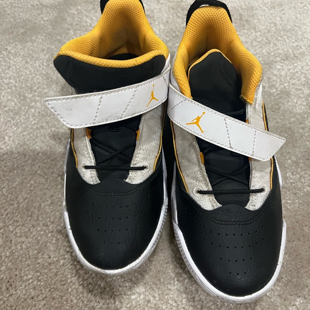 Worn but good condition air Jordan’s black white and yellow  size 2 little boy
